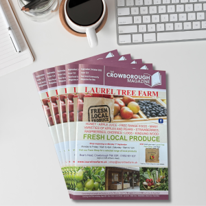 Issues of the Crowborough Magazine fanned out on a desk